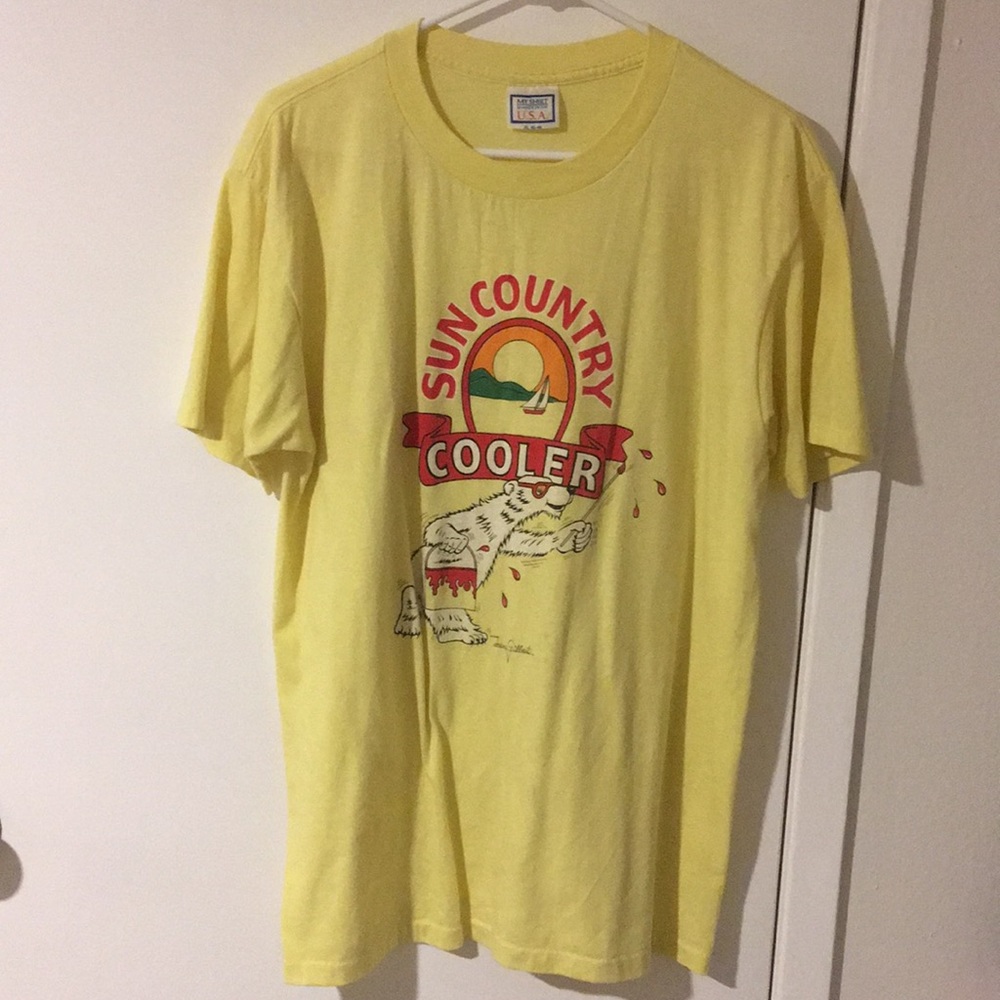 Sun Country Cooler logo on bright yellow T-shirt